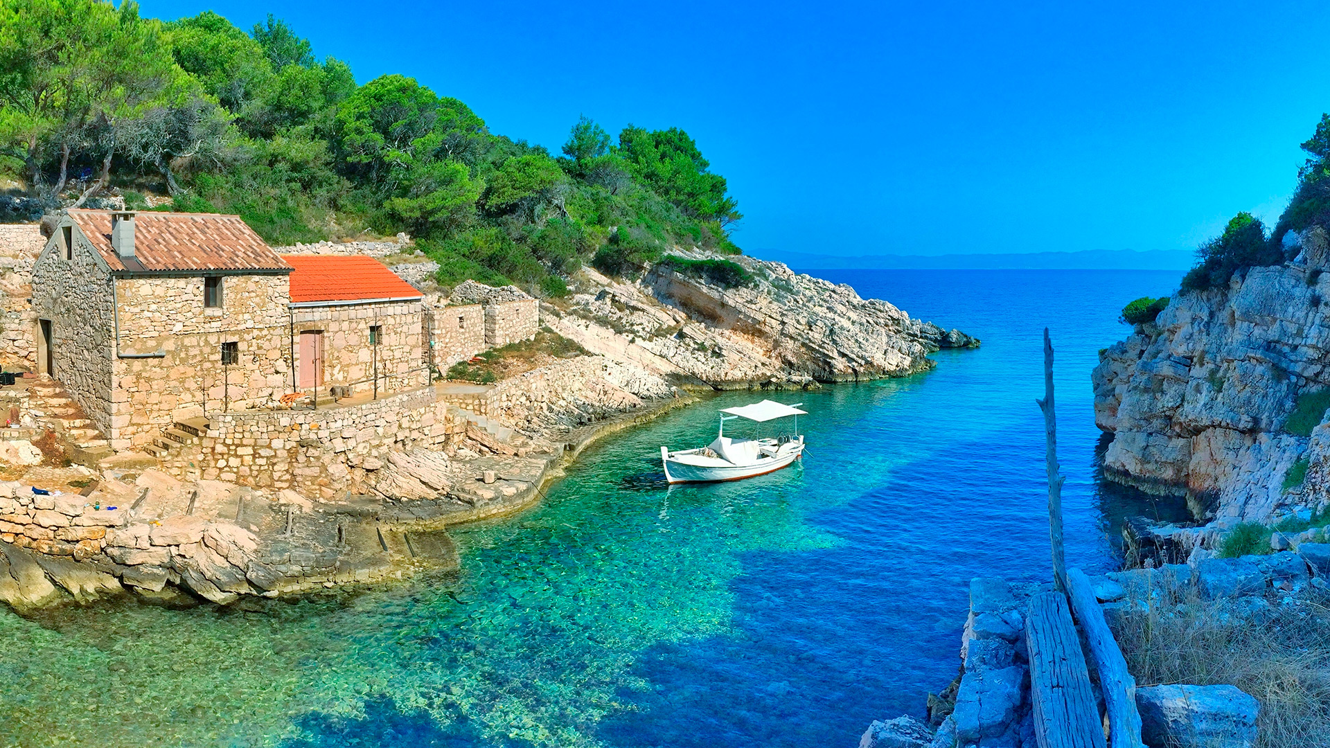 Bay with old stone houses and fishing boat, Lastovo island, Croatia